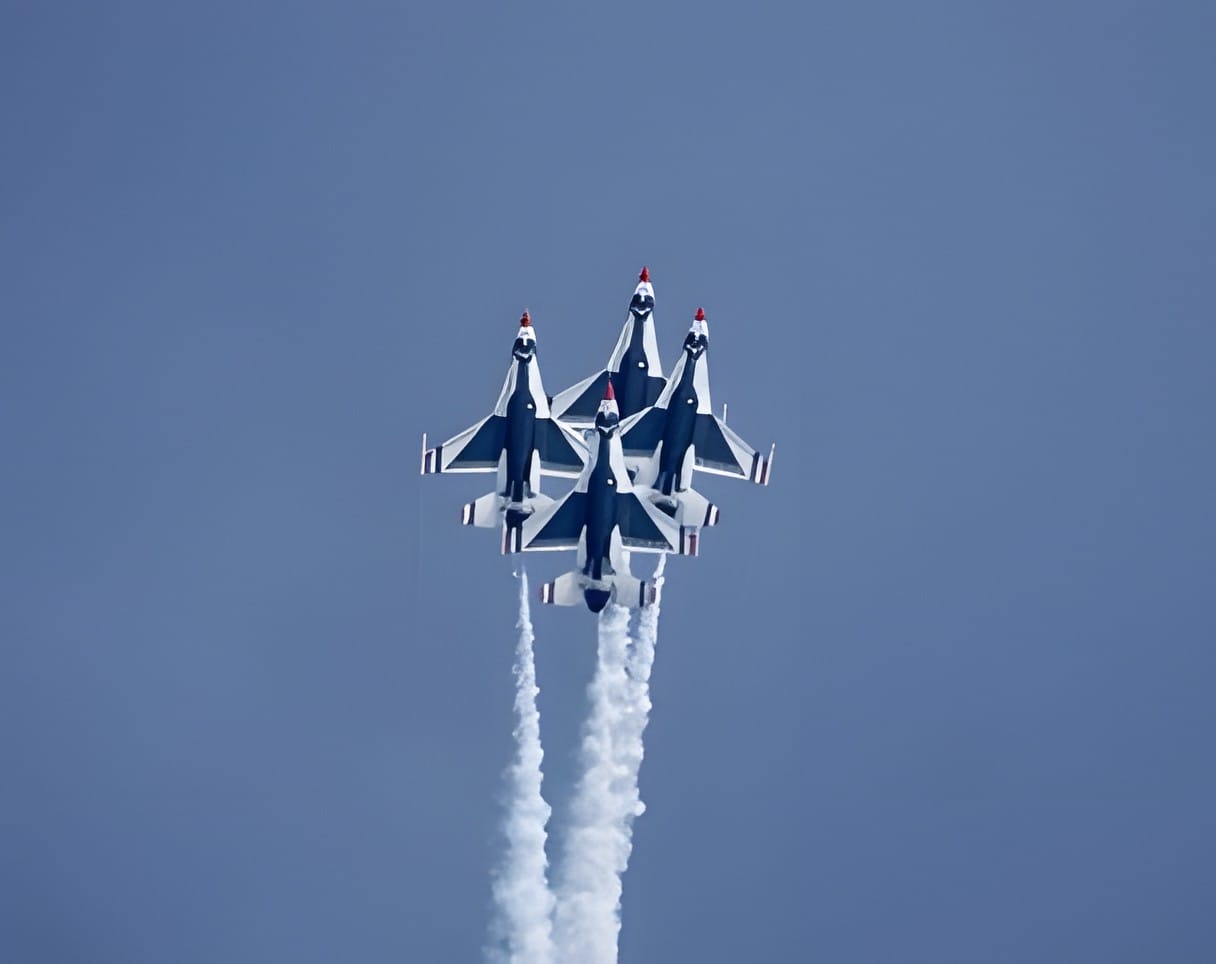 Four Thunderbirds jets in tight diamond formation