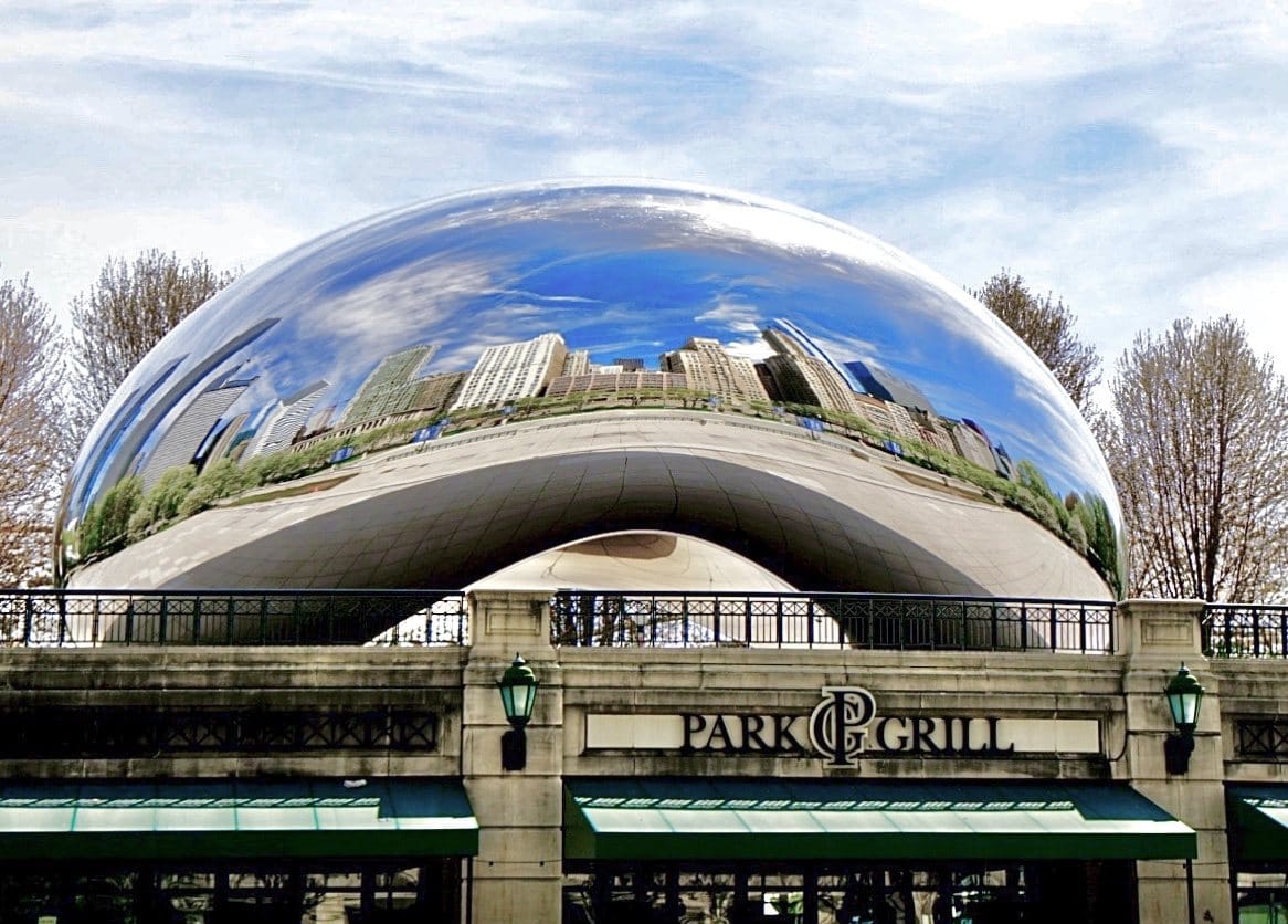 Cloud Gate reflecting the Chicago skyline above the Park Grill